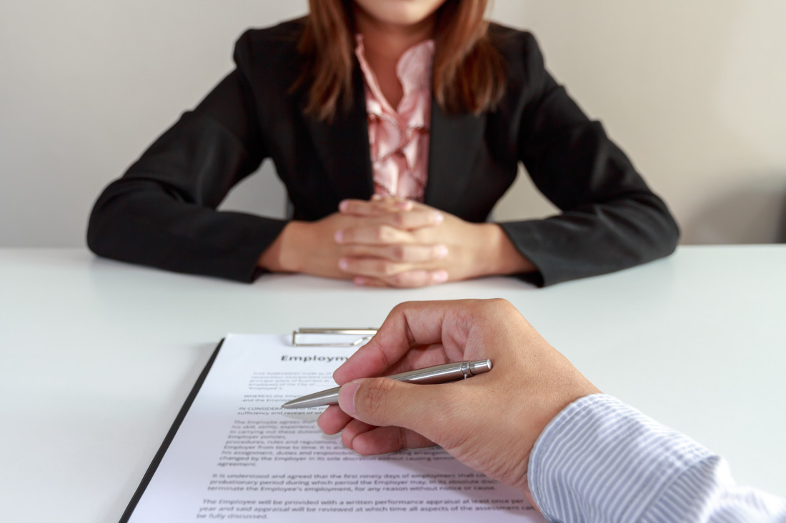 Employee Signing a Contract
